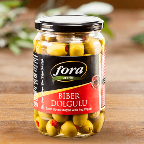 Jar of Fora green olives stuffed with red pepper in a glass jar