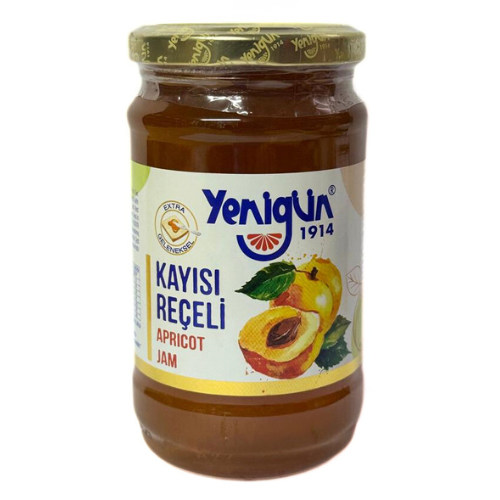 Jar of Yenigun apricot jam on a white background