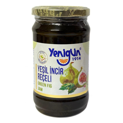Jar of Yenigun green fig jam on a white background