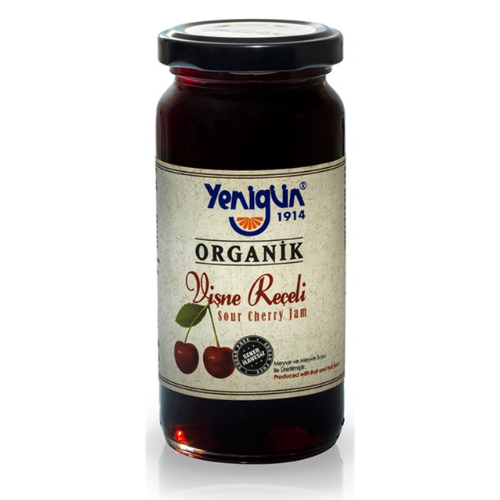 Jar of Yenigun Organic sour cherry jam on a white background