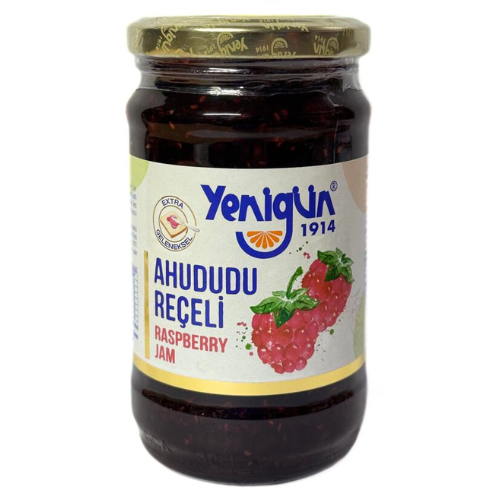 Jar of Yenigun raspberry jam on a white background