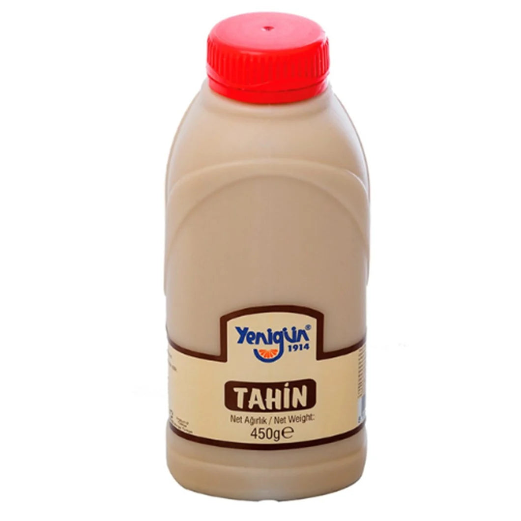 Bottle of Yenigun Tahin Sesame Paste with a red cap on a white background